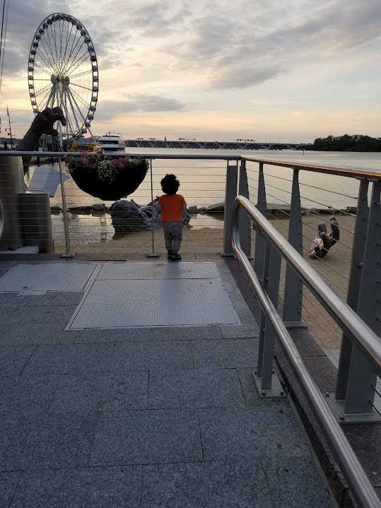 Child at the National Harbor waterfront