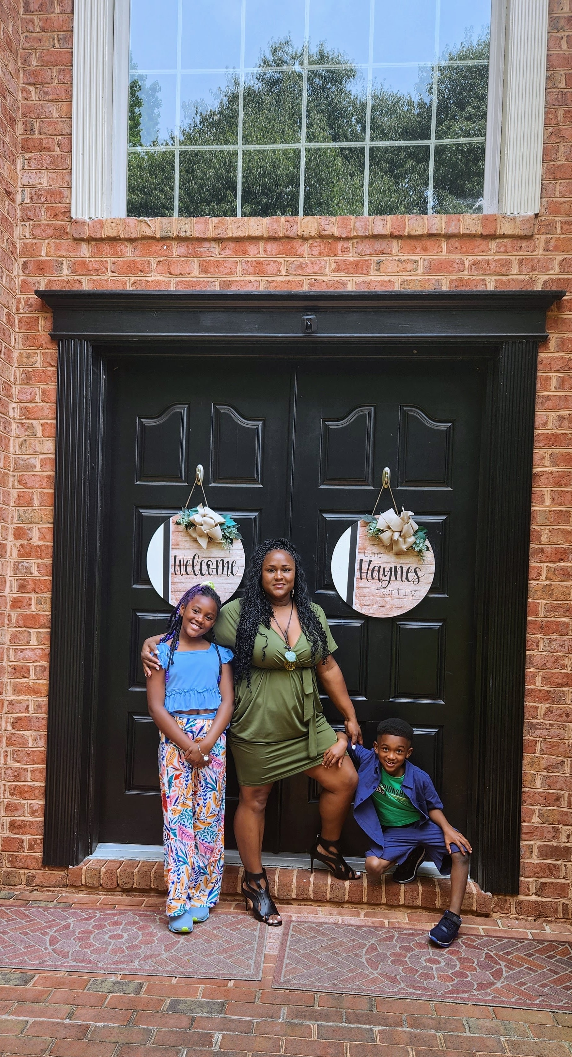 Attorney Haynes and children at the Welcome Haynes doors