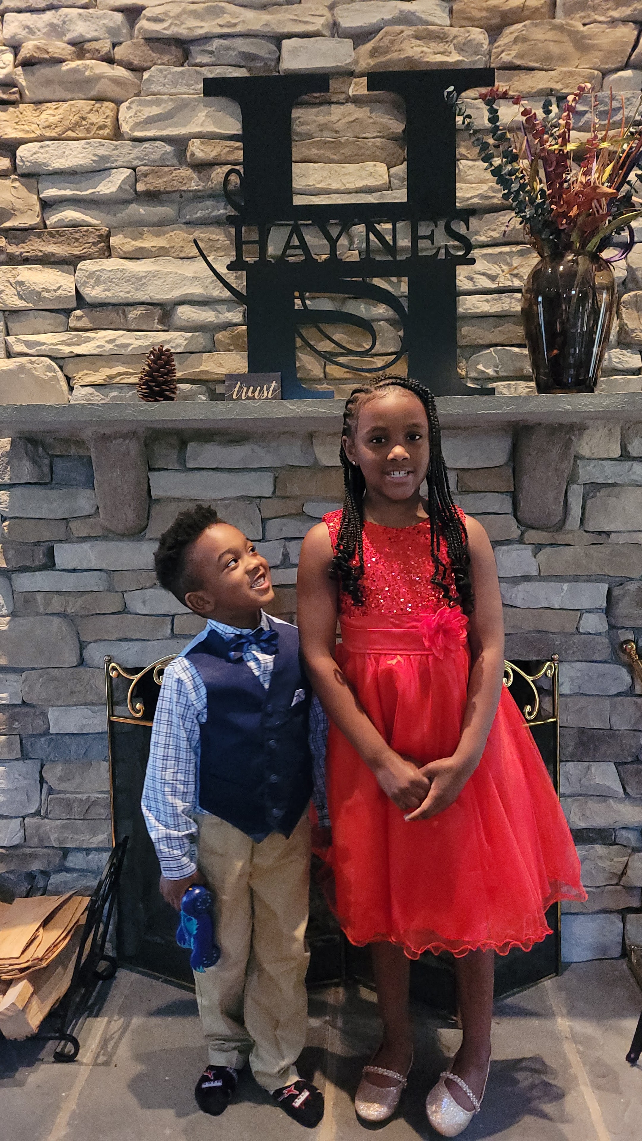 Attorney Haynes's children in front of the Haynes Group sign